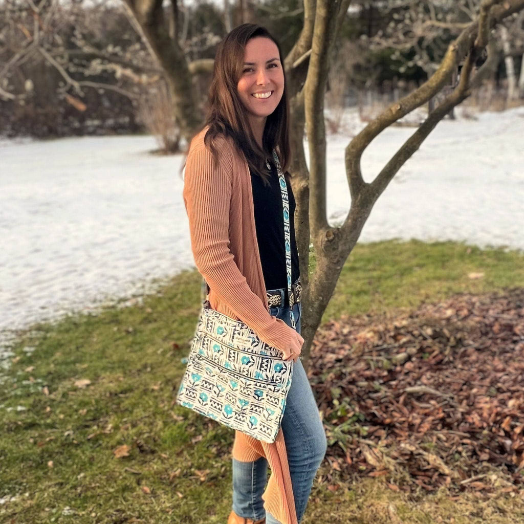 Patchwork patterned crossbody bag in turquoise and white with top zip closure