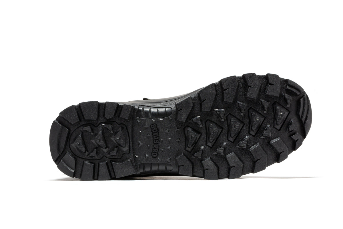 Black tactical boot outsole with deep tread and durable rubber traction pattern