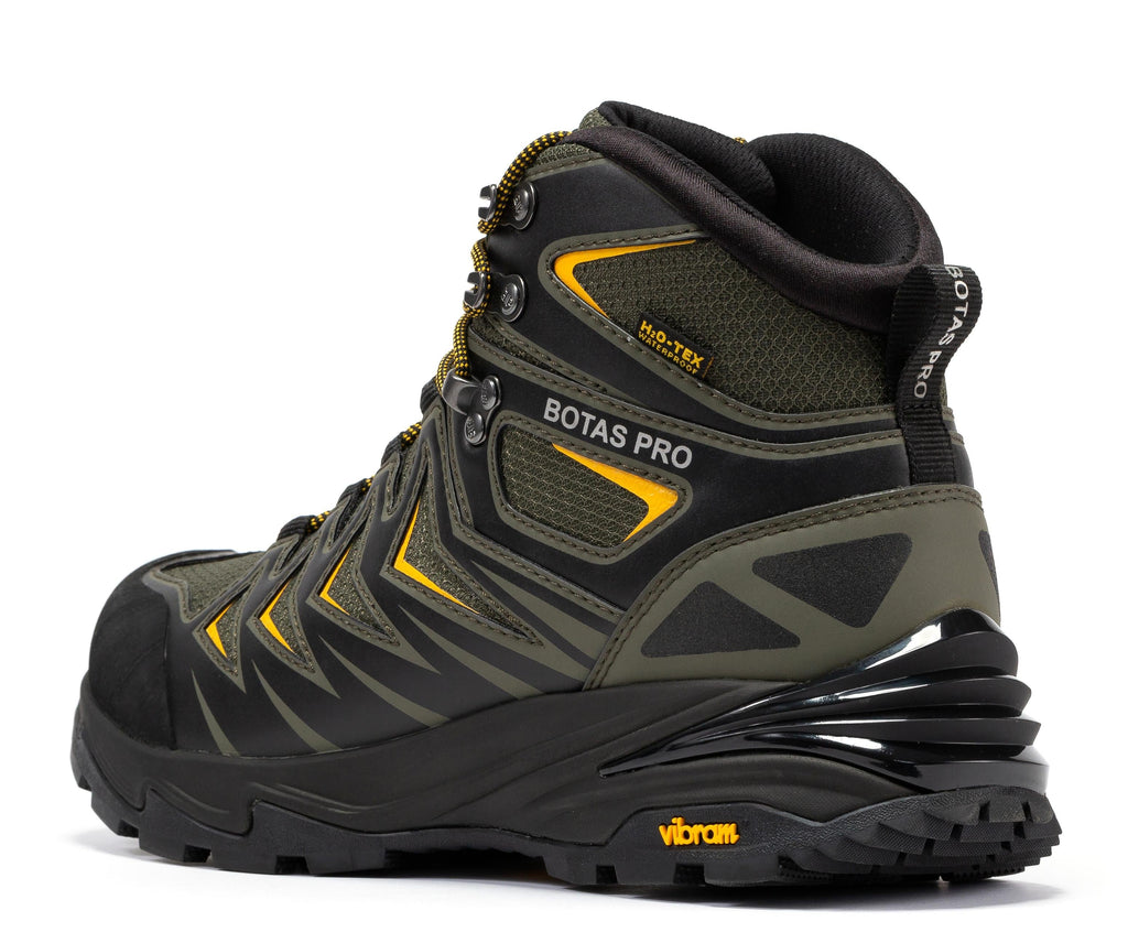 Waterproof hiking boot, side view in dark green with yellow trim and lugged rubber sole