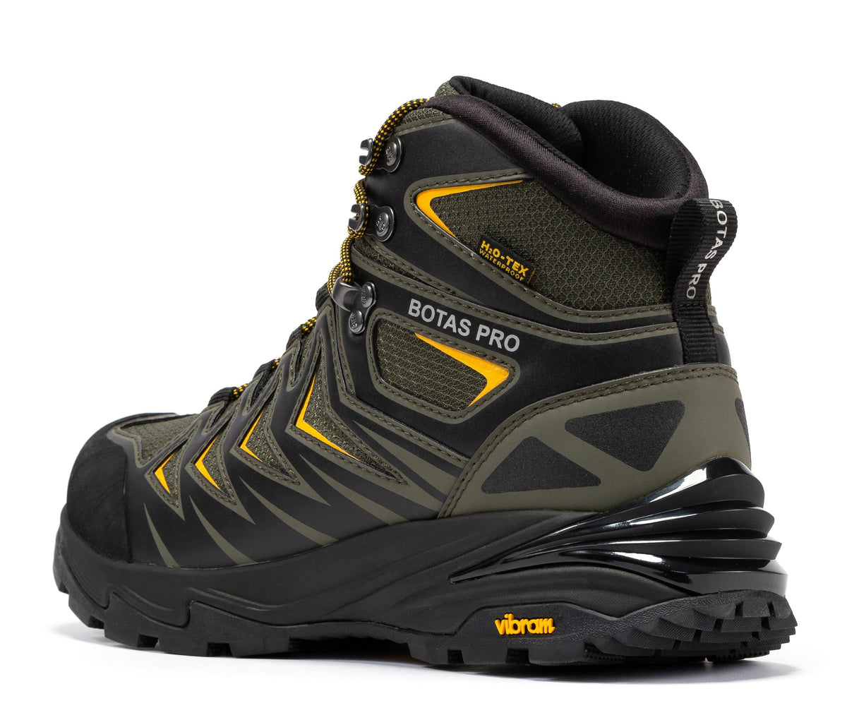 Waterproof hiking boot, side view in dark green with yellow trim and lugged rubber sole