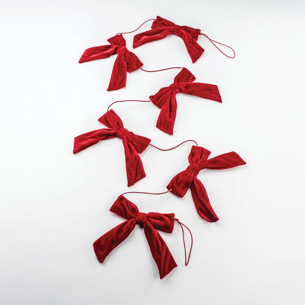 Red velvet bow garland with multiple tied bows on red string