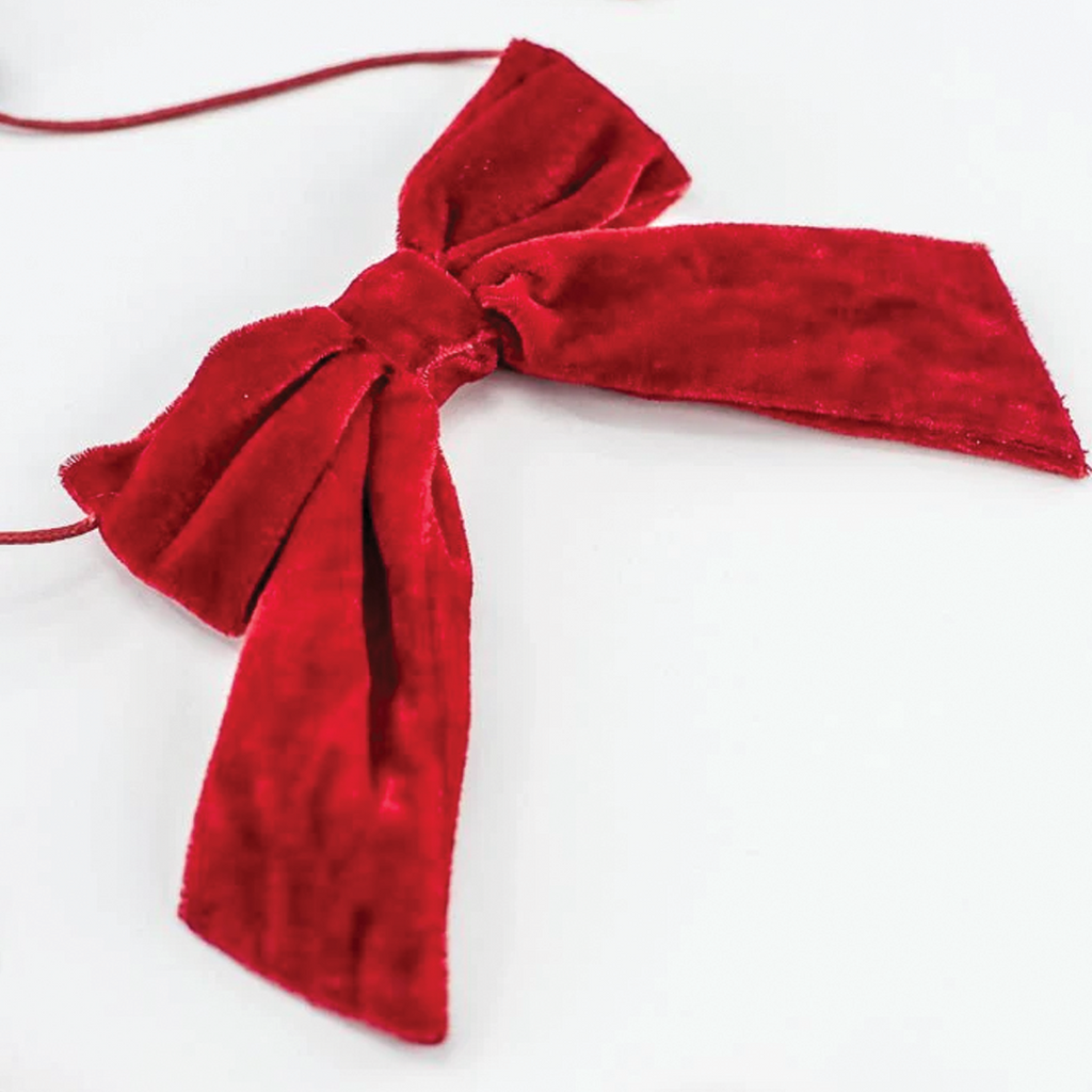 Single red velvet bow on a cord with short hanging ribbon tails