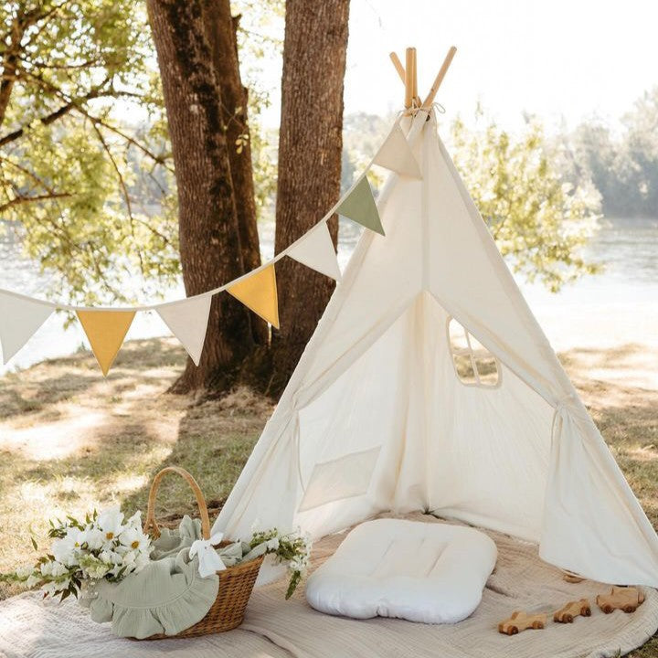 Kids indoor teepee tent with white canvas, open window, and floor mat cushions
