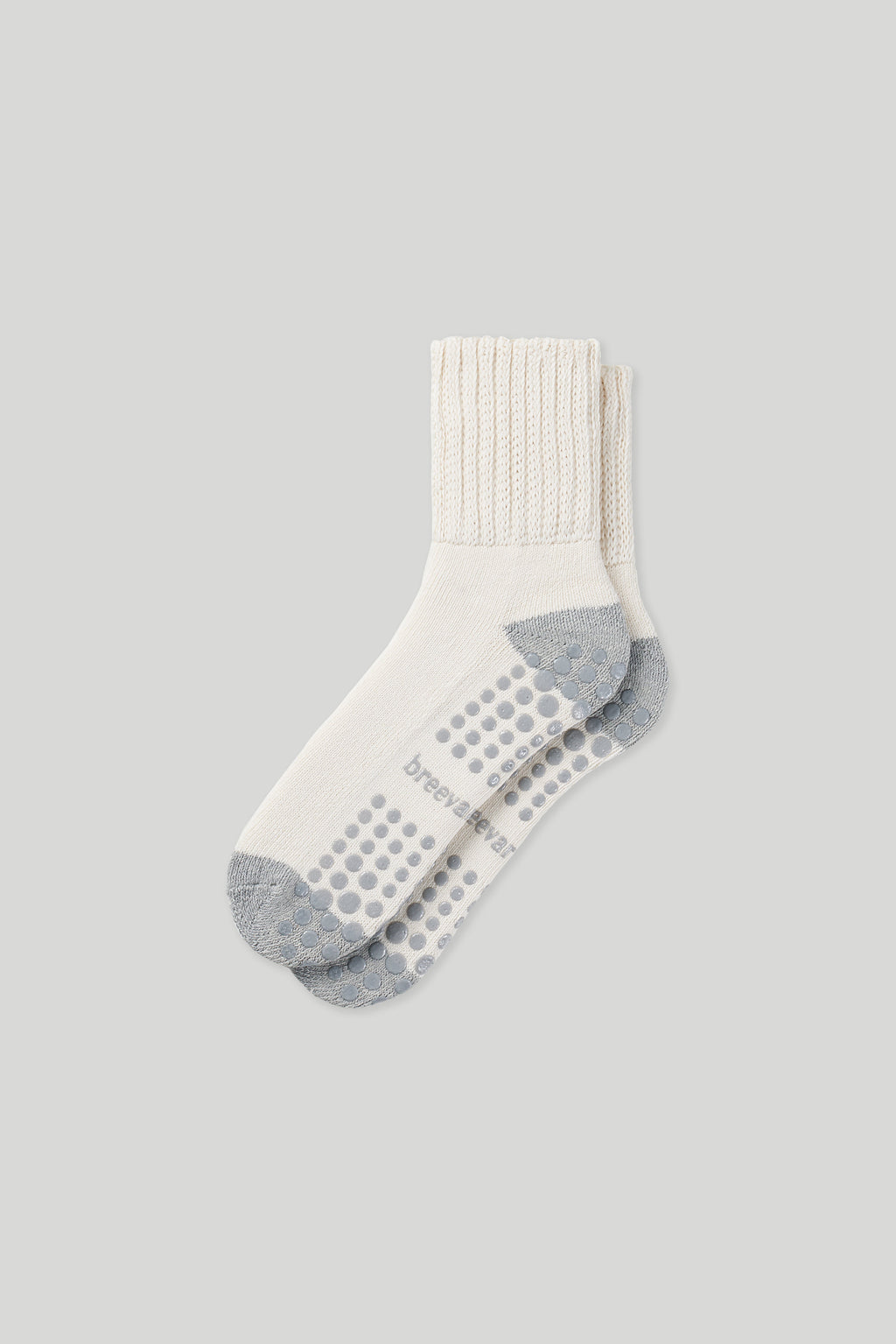 Single men’s crew sock in white with gray toe/heel and non-slip dots