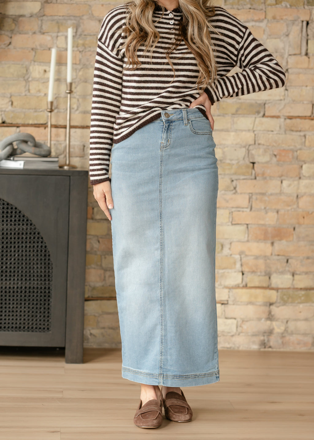 Light wash denim maxi skirt with front seam and straight, ankle-length cut