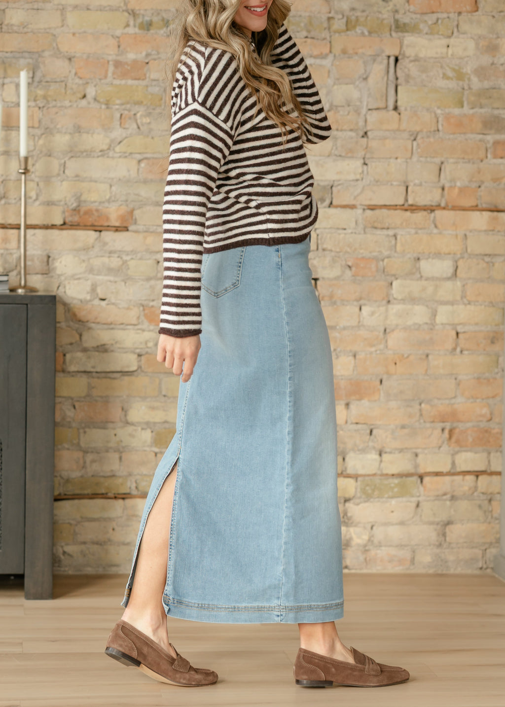 Light wash denim maxi skirt with side slit and mid-blue denim wash