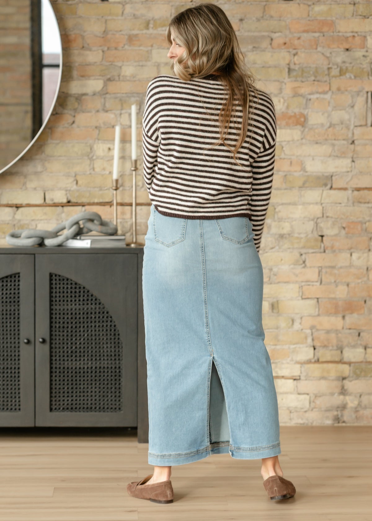 Light wash denim maxi skirt with front slit opening and center seam