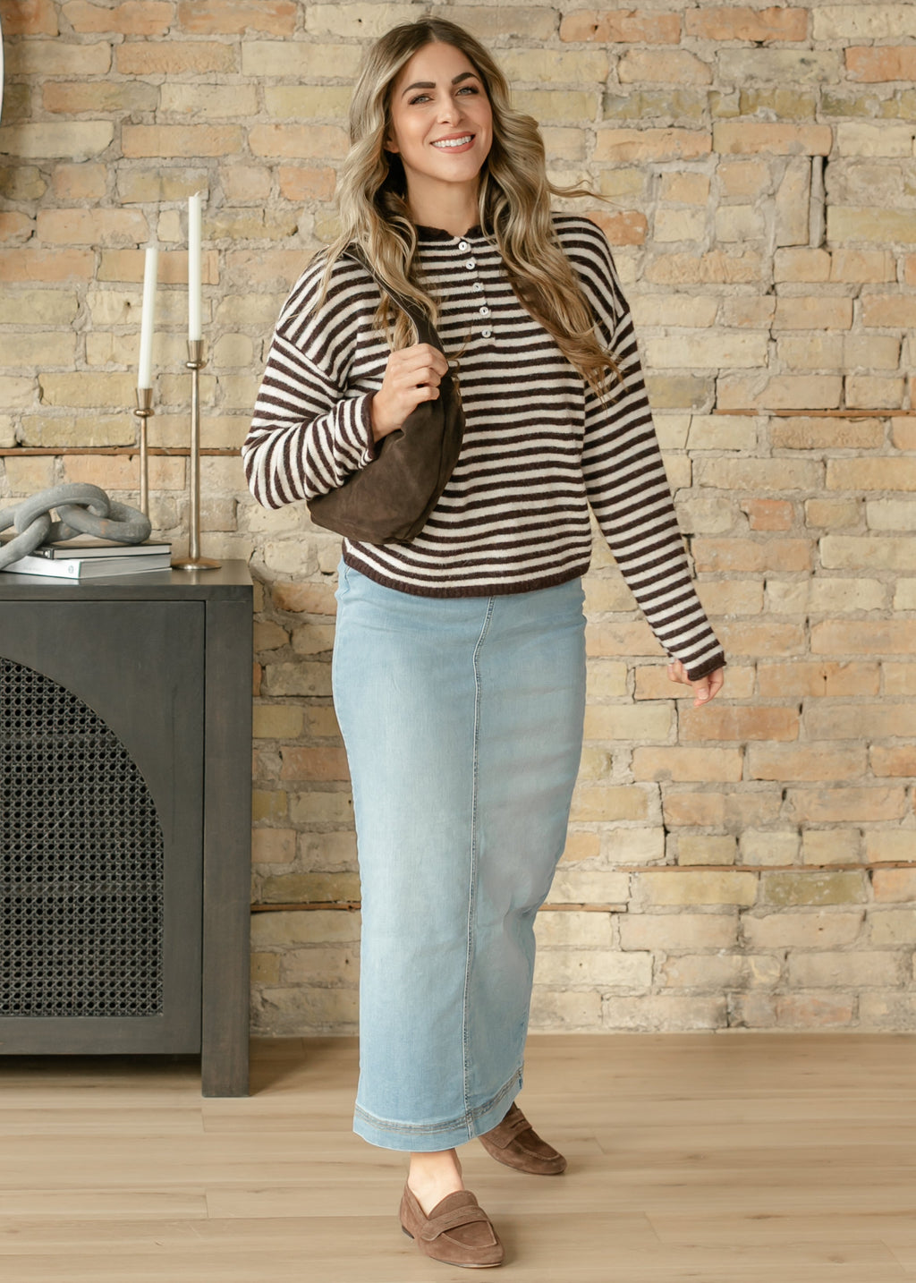 Light wash denim maxi skirt with front seam and clean straight hem