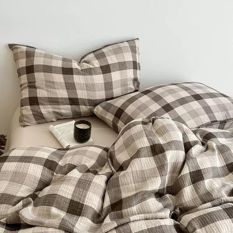 Brown-and-gray plaid duvet cover set with square pillow shams and a patterned duvet.