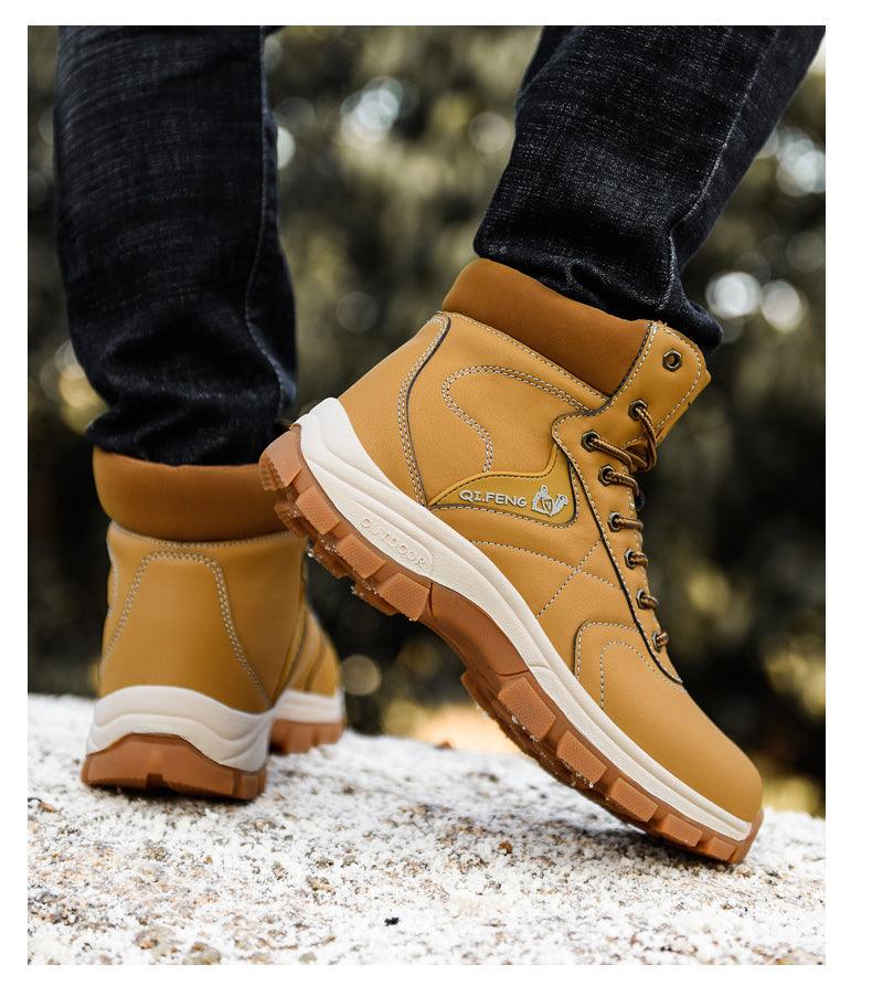 Men's tan winter hiking boots, lace-up ankle style with deep tread sole