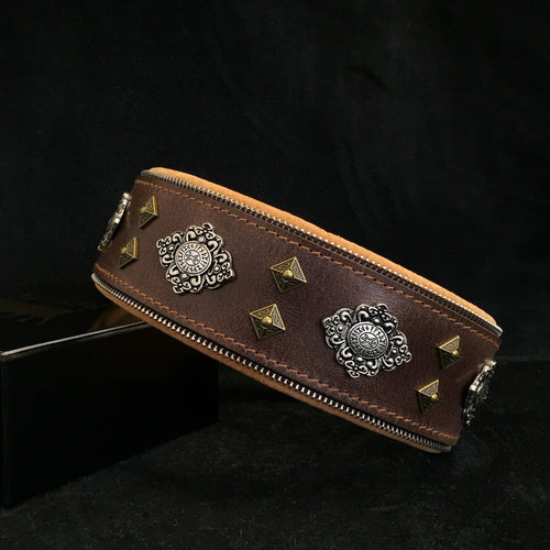 Brown dog collar with Aztec-style silver emblem and bronze pyramid studs