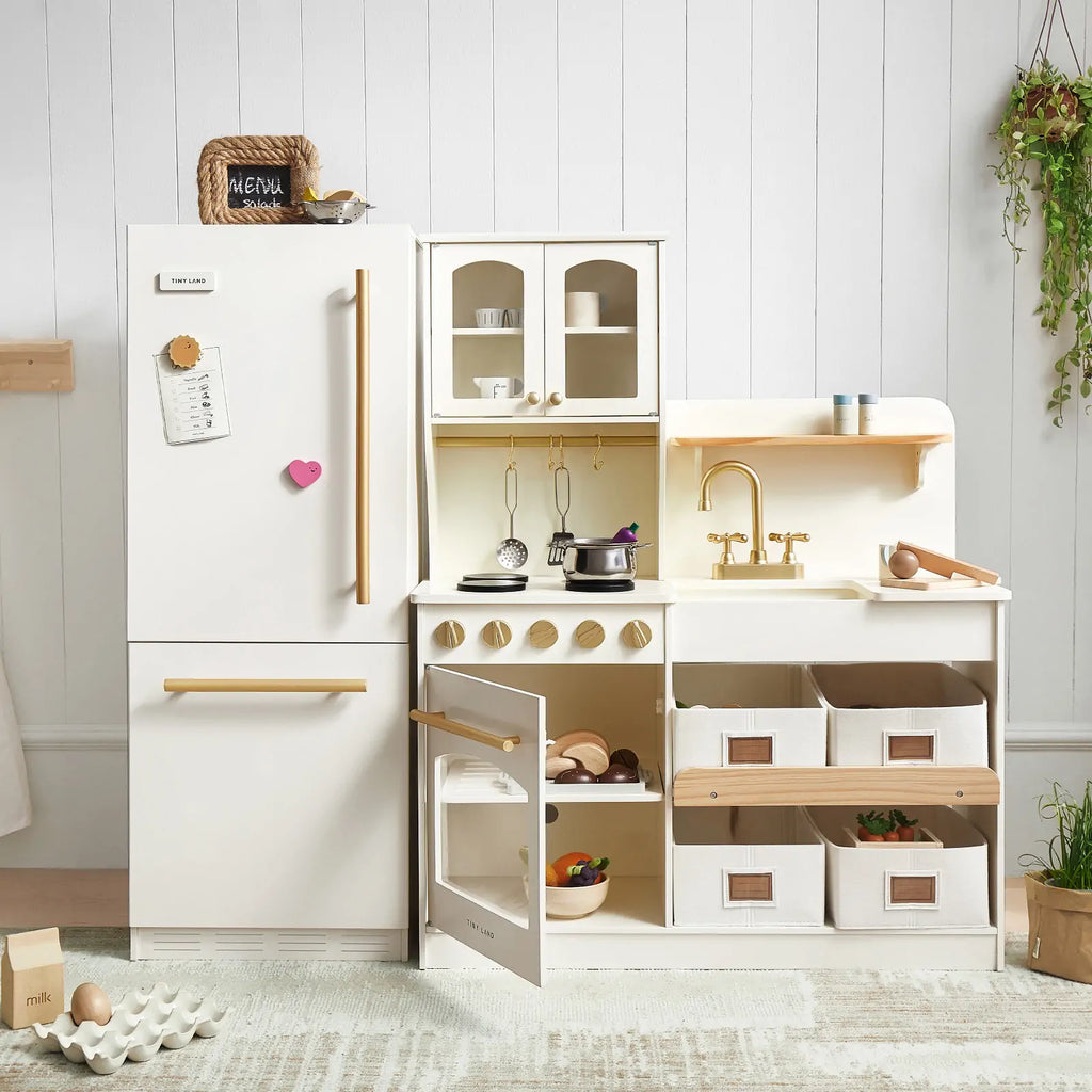 White play kitchen refrigerator cabinet with open compartments and golden pull handle