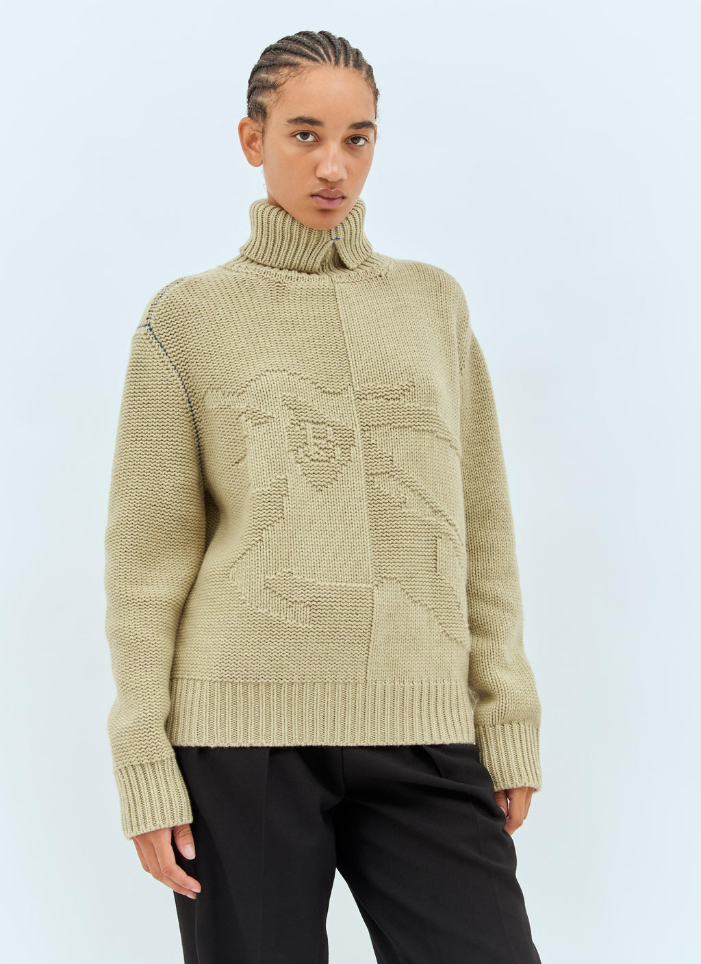Women’s cream cashmere sweater with high turtleneck and tonal jacquard emblem