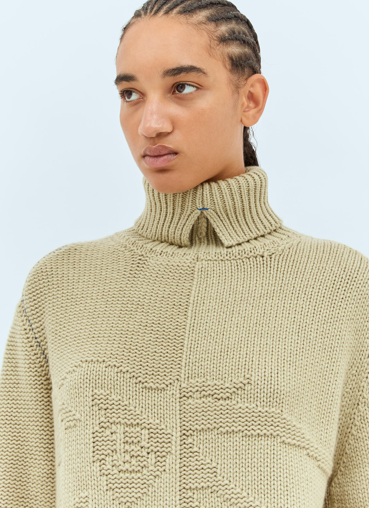 Women’s cream cashmere sweater with ribbed high turtleneck and tonal emblem detail