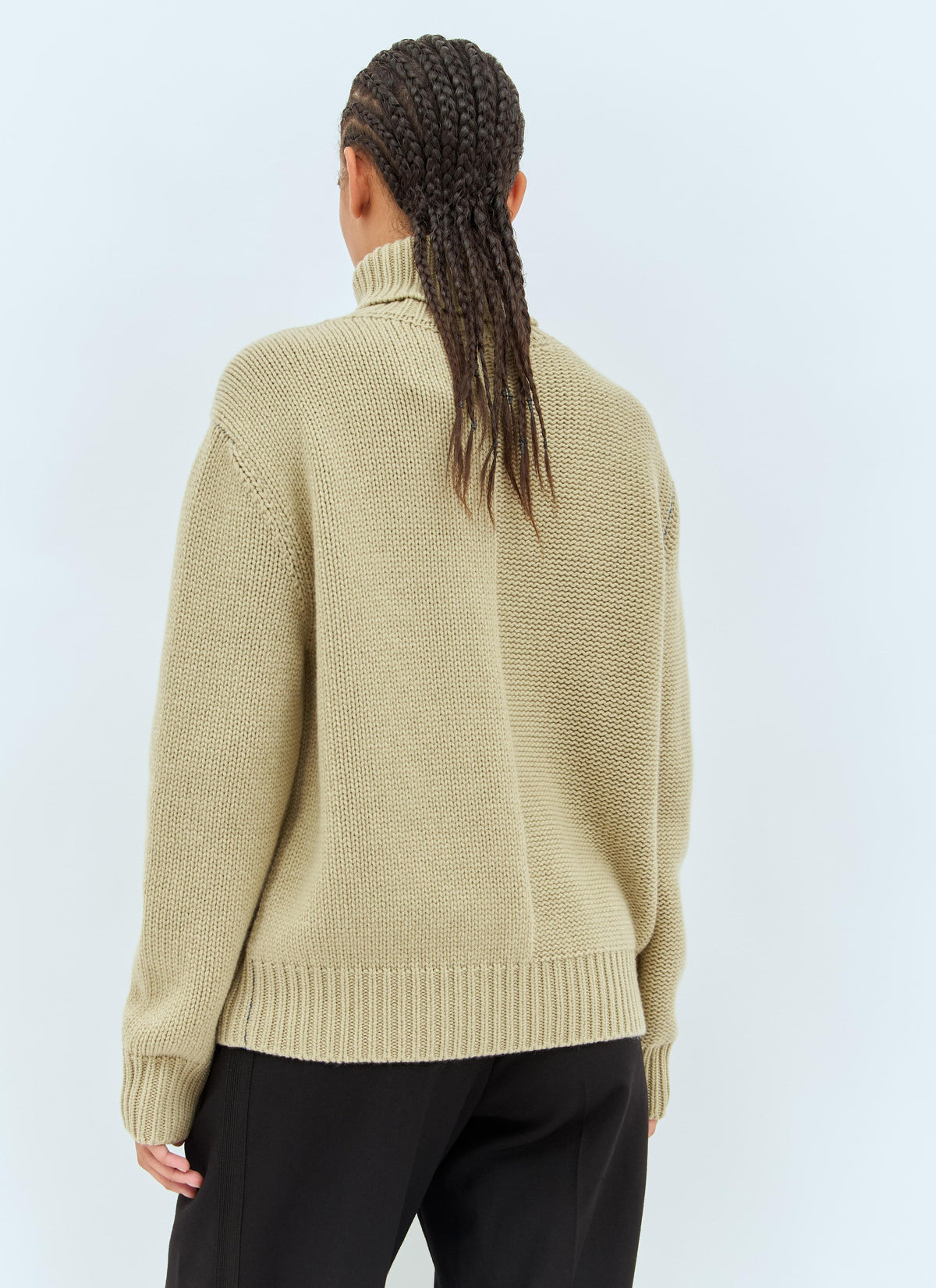 Women’s cream cashmere sweater with knit back yoke and ribbed waistband