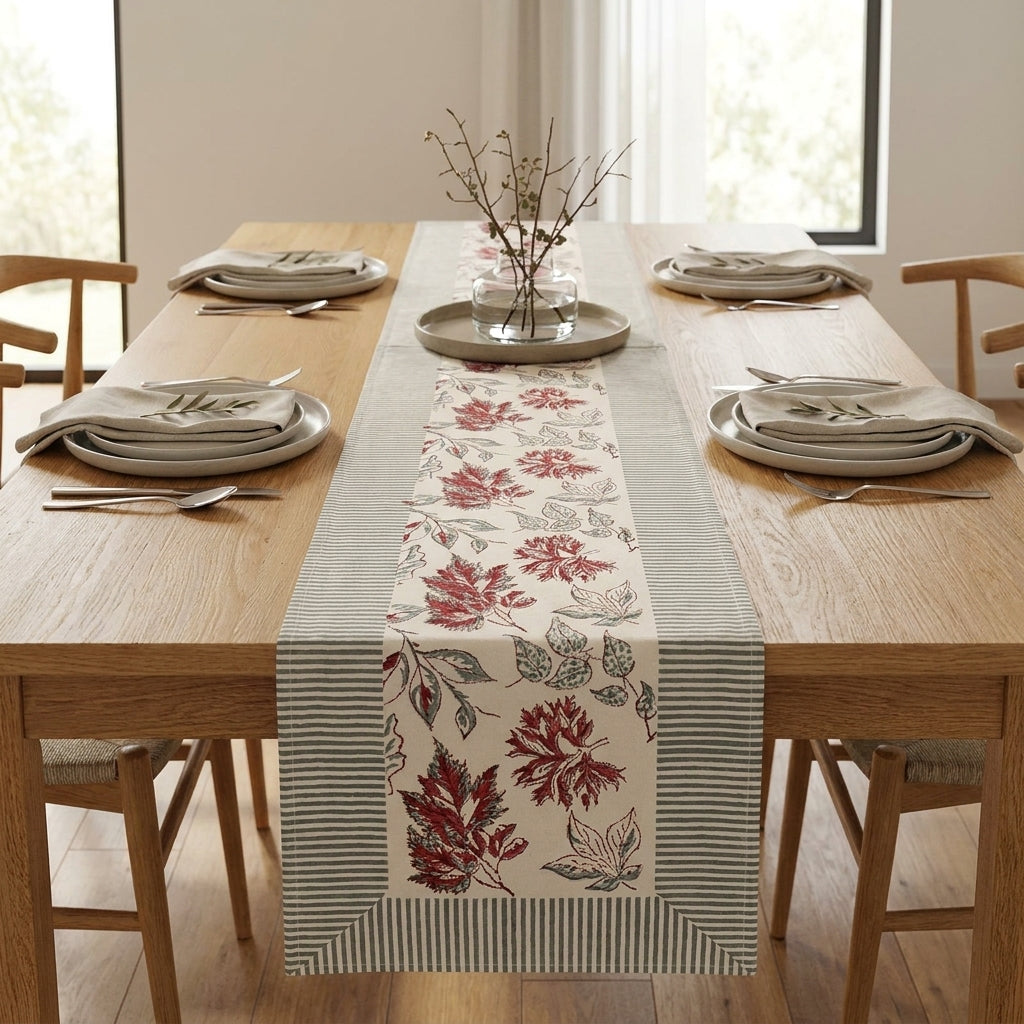 Table runner with red autumn leaf print and light slate-blue striped borders