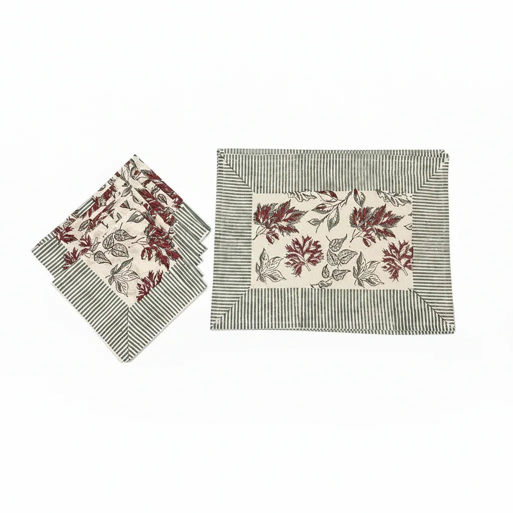Placemats and napkin set with red leaf motifs on cream and blue striped borders