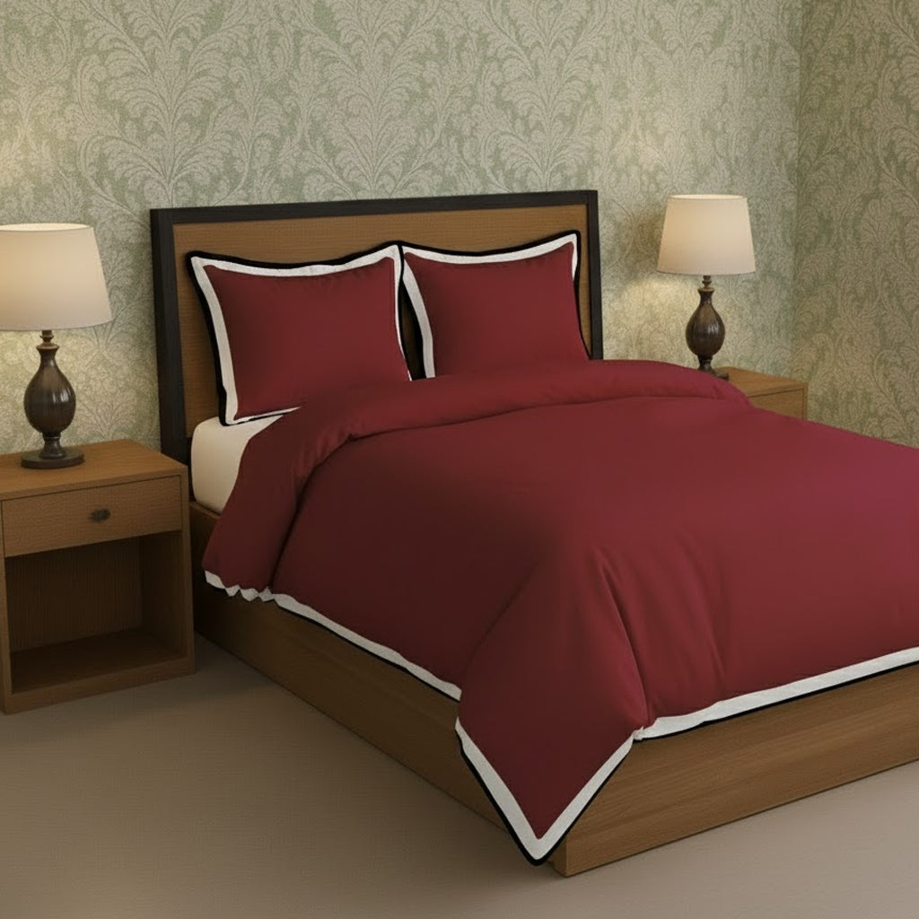 Burgundy duvet cover set with white border frame and matching pillowcases