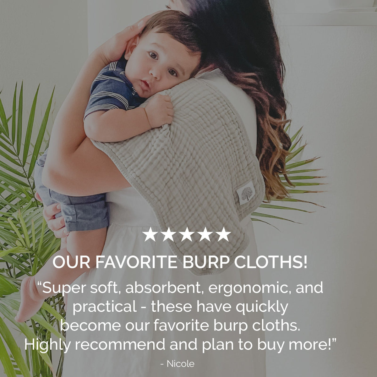 White muslin burp cloth across baby’s chest, textured cloth with small square patch