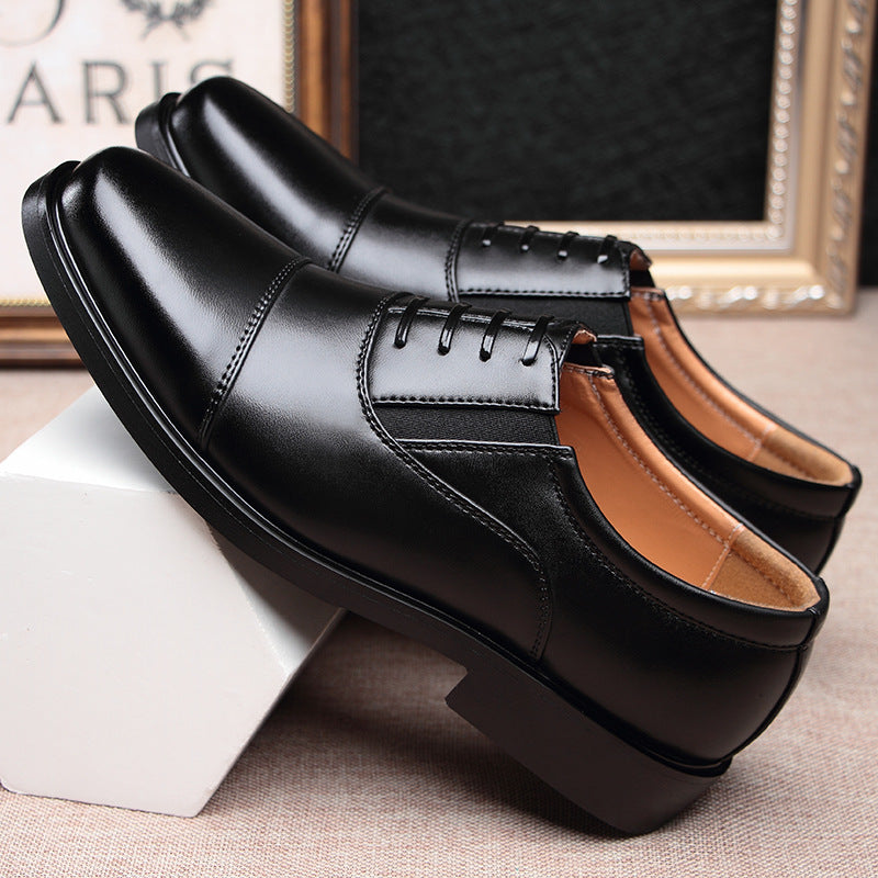 Men's black leather lace-up dress shoes, side view with stitched details
