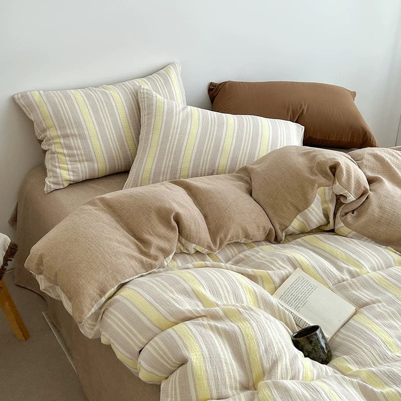 Butter yellow striped duvet cover set with matching pillowcases, striped fabric bedding.