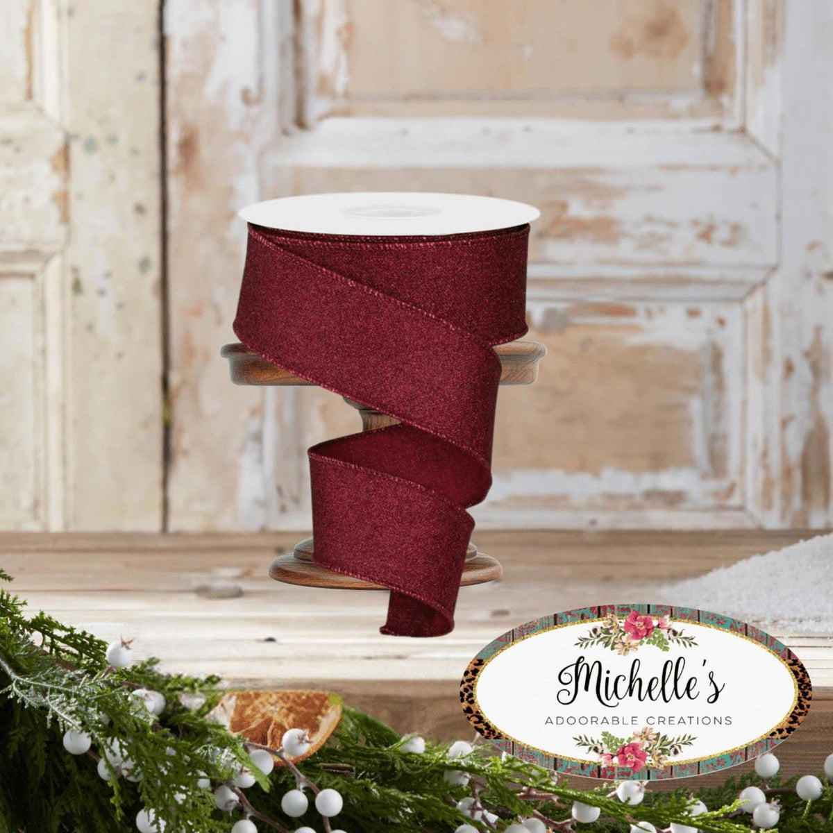 Burgundy fine glitter ribbon spool with ribbon wrapped in a wide loop