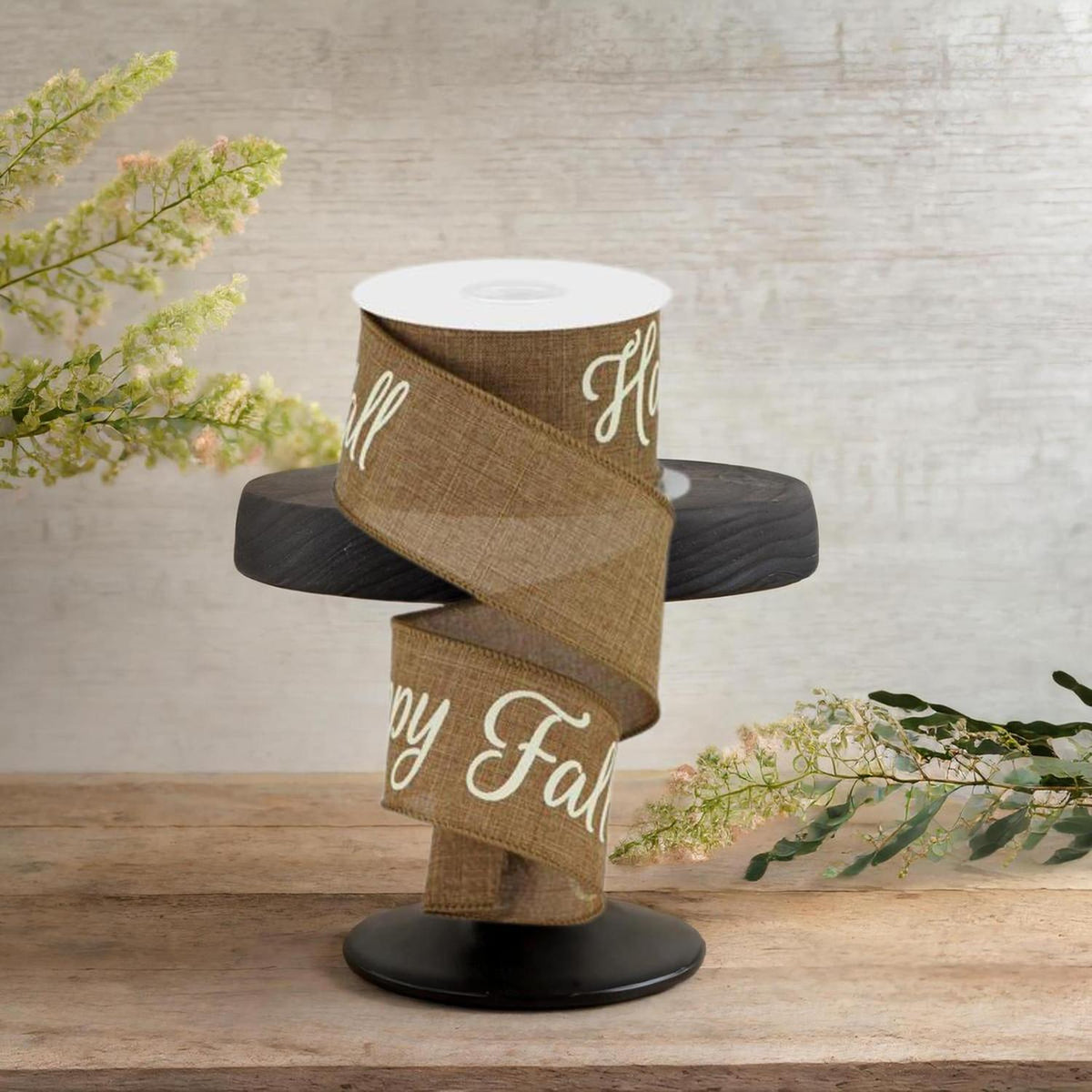 Tan burlap ribbon spool on a black base, “Happy Fall Y’all” text