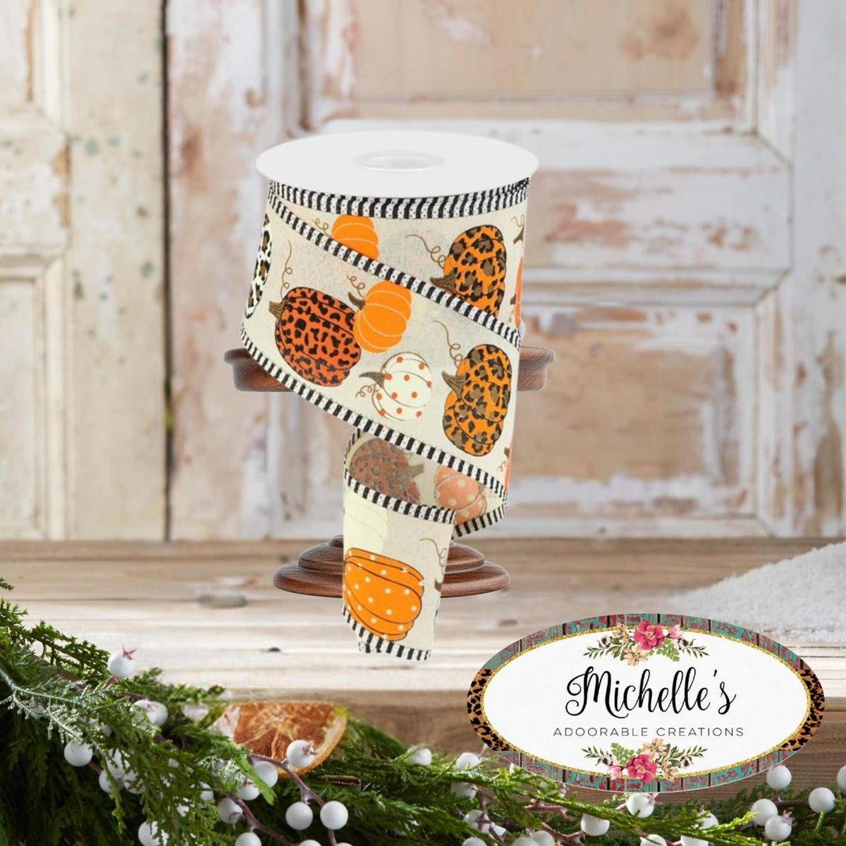 Cream pumpkin and leopard print ribbon roll with striped trim, full view on stand.