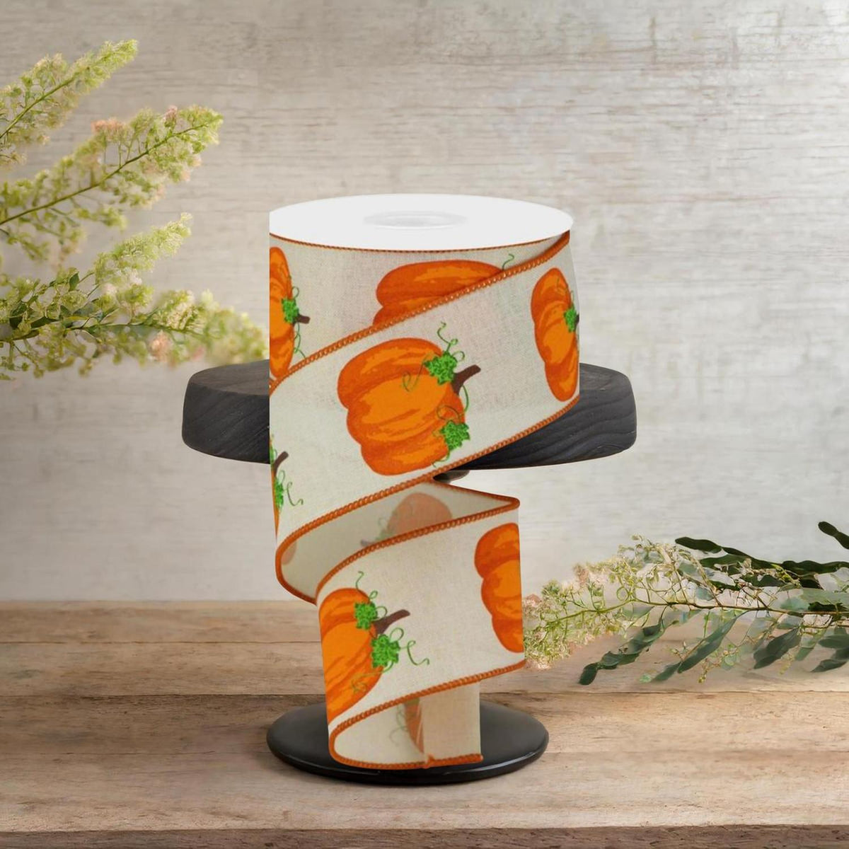 Cream pumpkin ribbon spool, orange pumpkin faces and green vine details