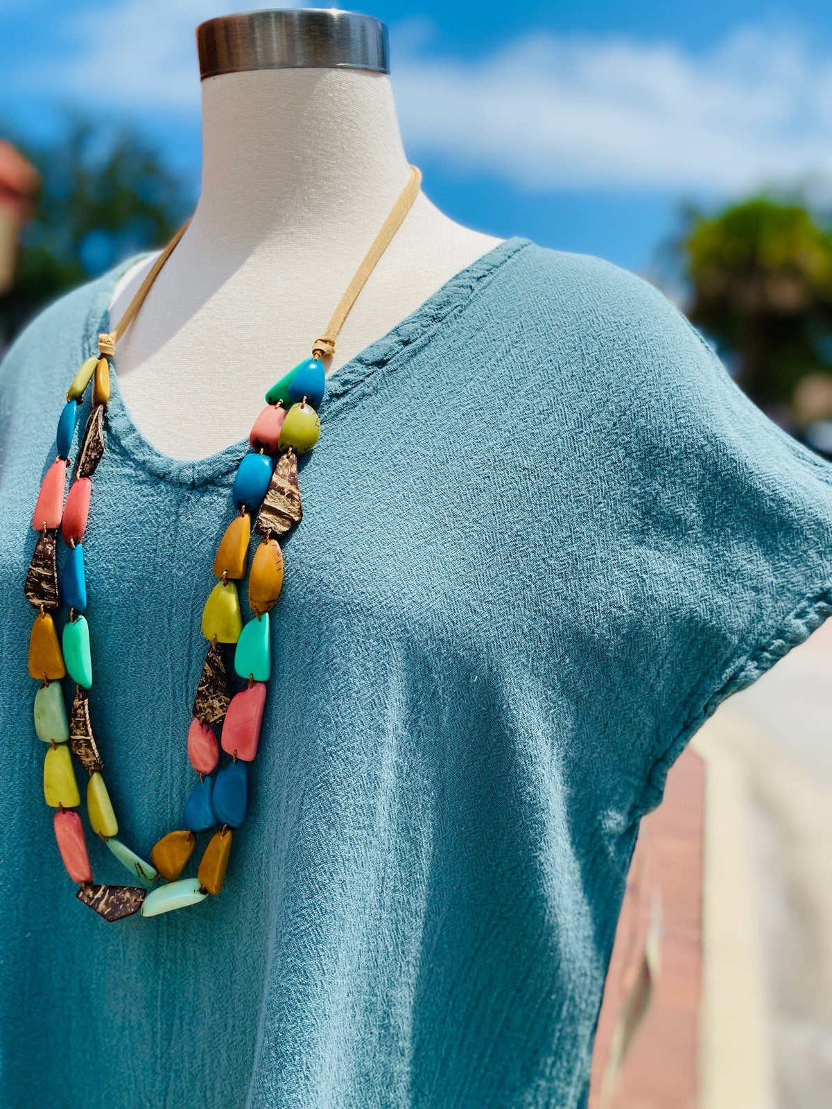 Blue cotton gauze top with scoop V-neck and short sleeves, relaxed A-line fit