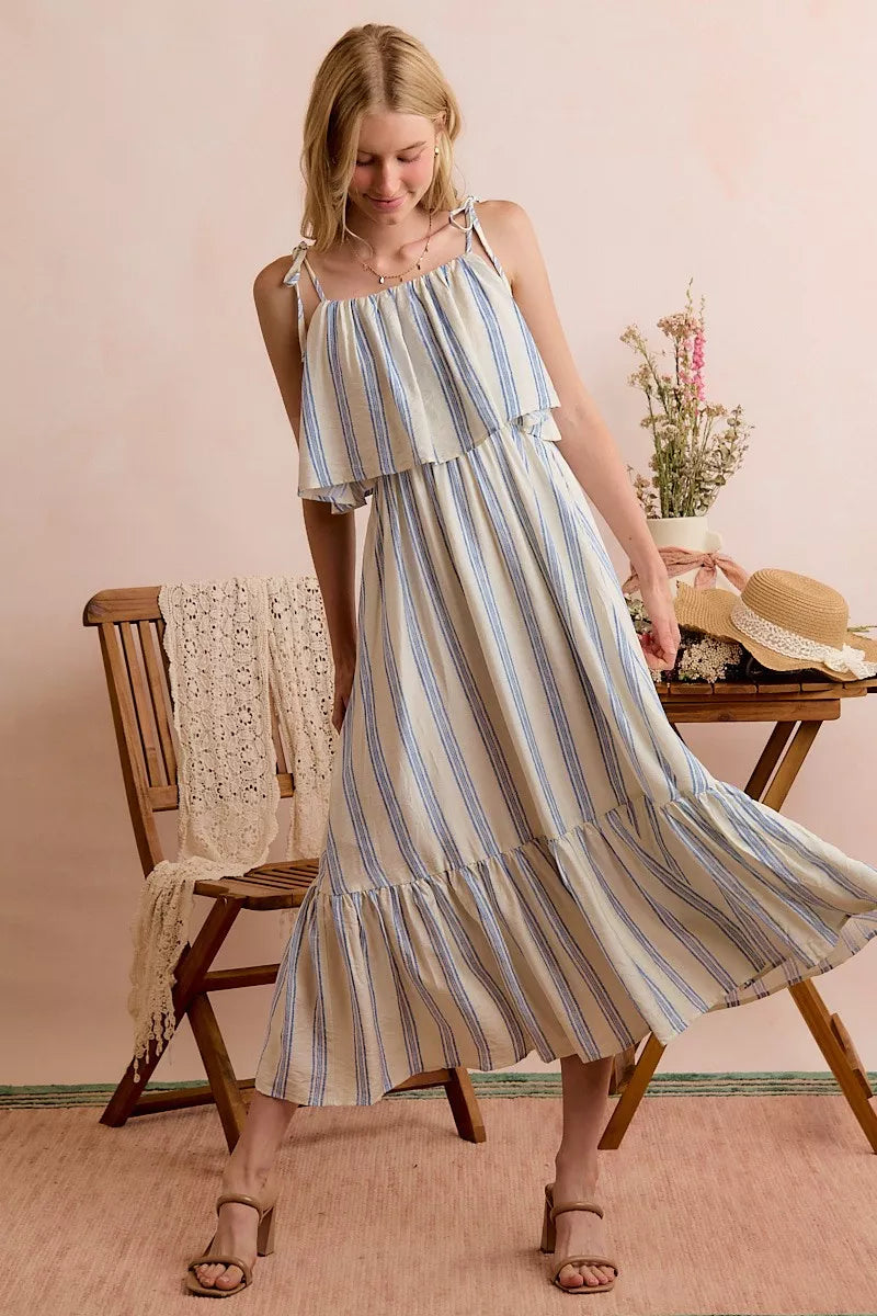 Blue-and-white striped midi dress with tiered skirt, ruffled top layer, and thin shoulder straps