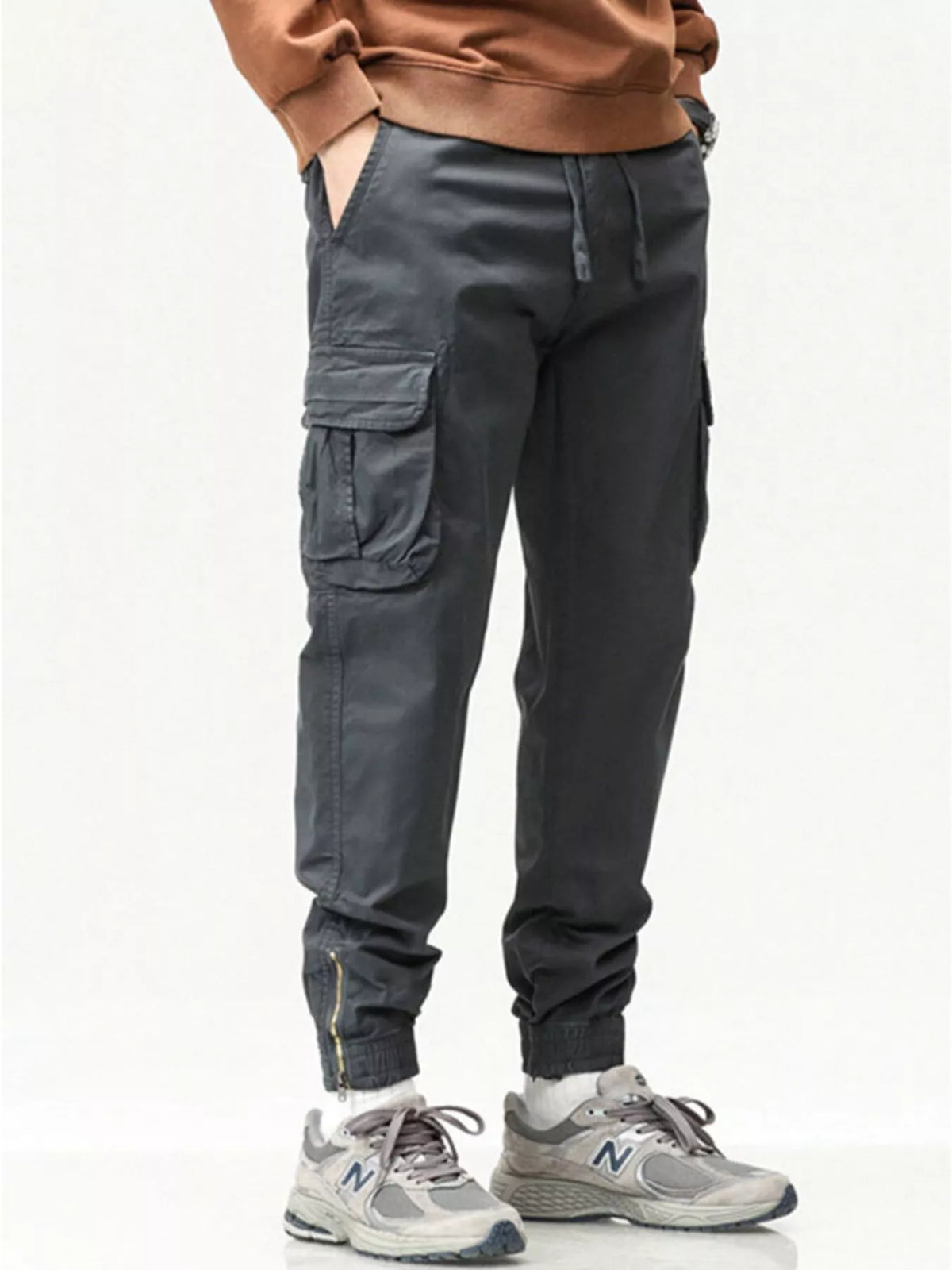 Men's casual cargo pants in charcoal gray with drawstring waist and cargo pocket tabs