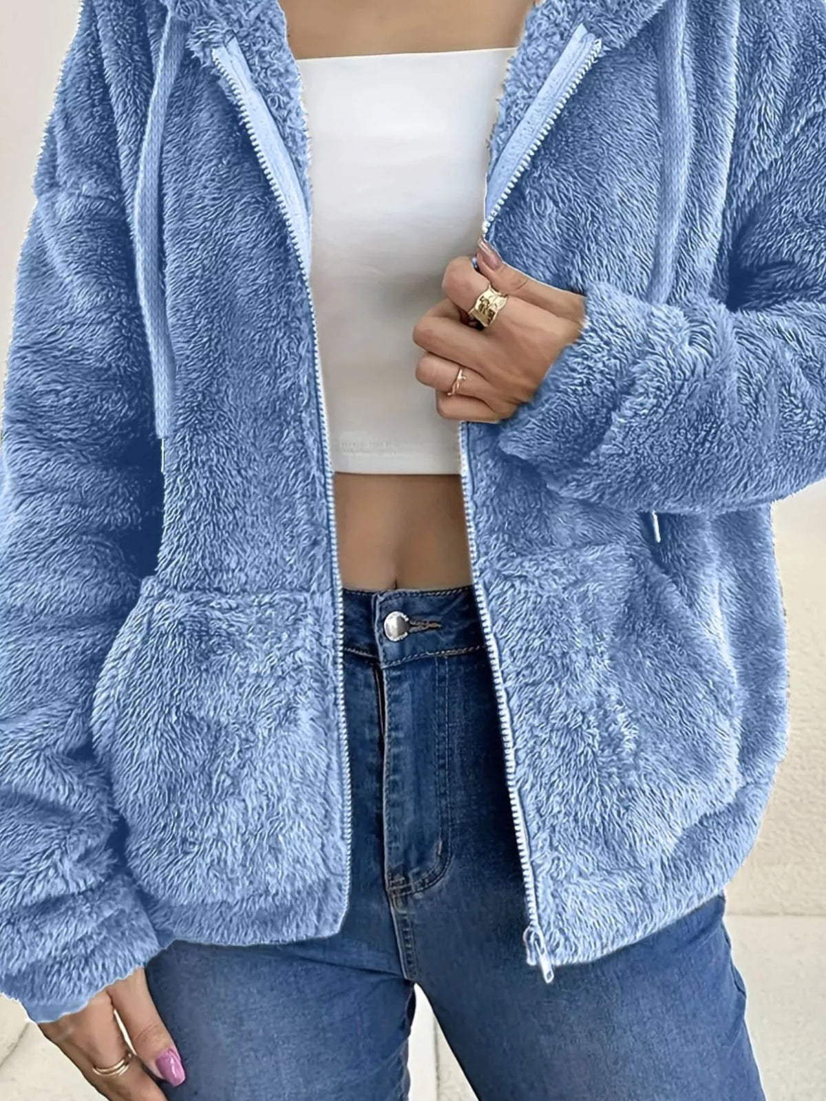 Sky blue fleece zip-up hoodie with hooded neckline and ribbed zip placket