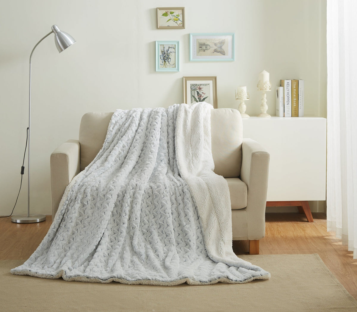 Light blue faux fur throw blanket draped over couch