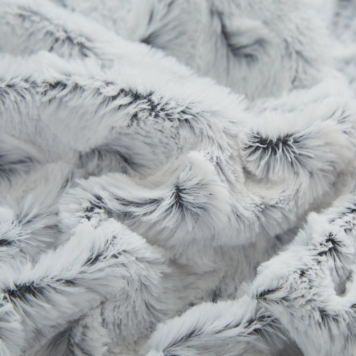 Light blue faux fur throw blanket tufted weave close-up