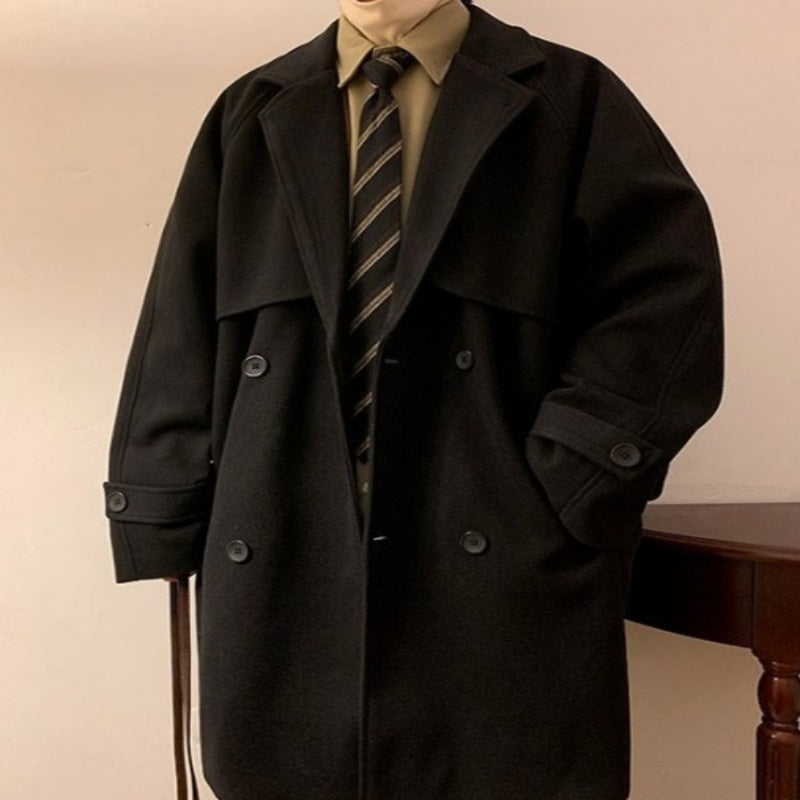 Black mid-length wool overcoat with notched lapels and buttoned double-breast front