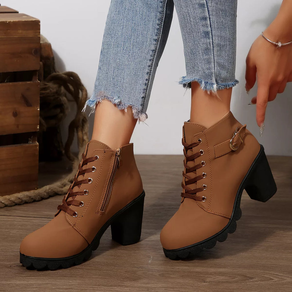 Tan lace-up ankle boots with chunky heel and front eyelets, side buckle strap detail