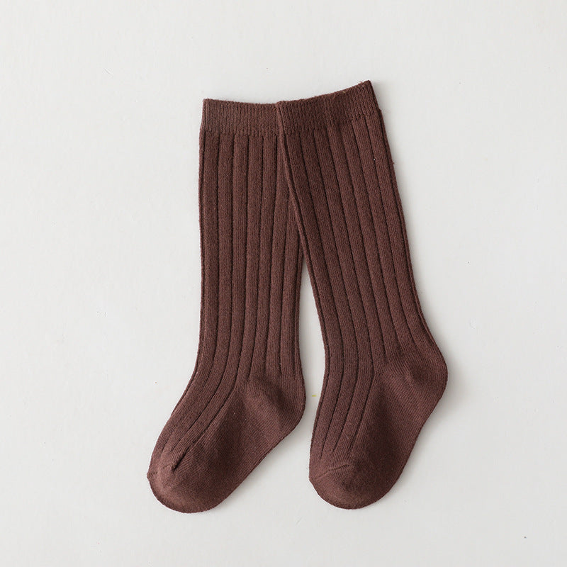 Pair of brown mid-calf ribbed baby socks.