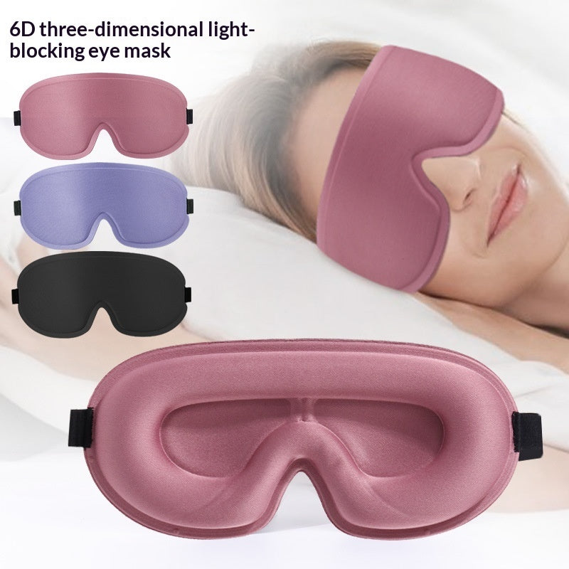 3D blackout sleep masks in pink, blue, and black laid out with contoured eye cups