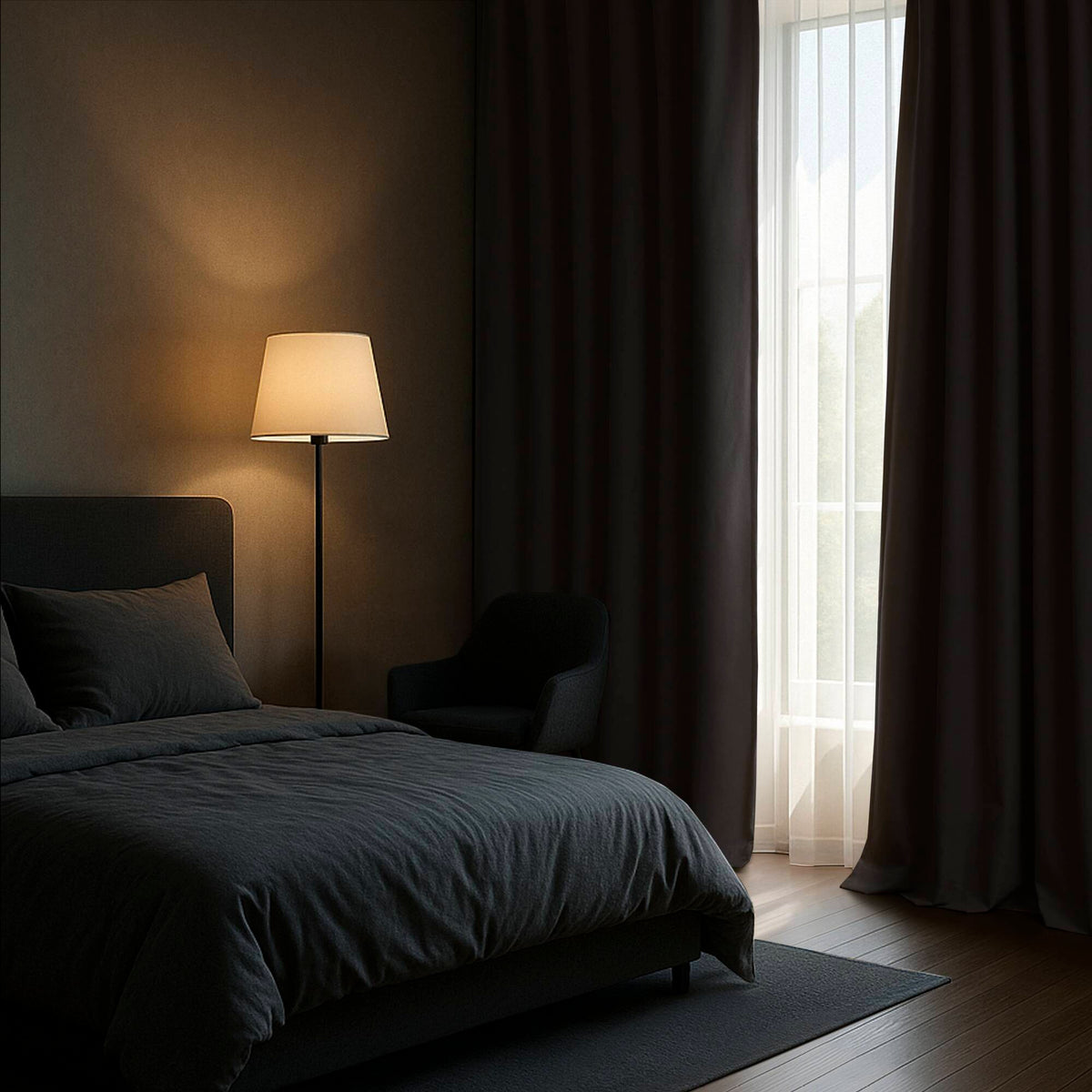 White blackout curtain panels hanging beside a window with soft drape folds