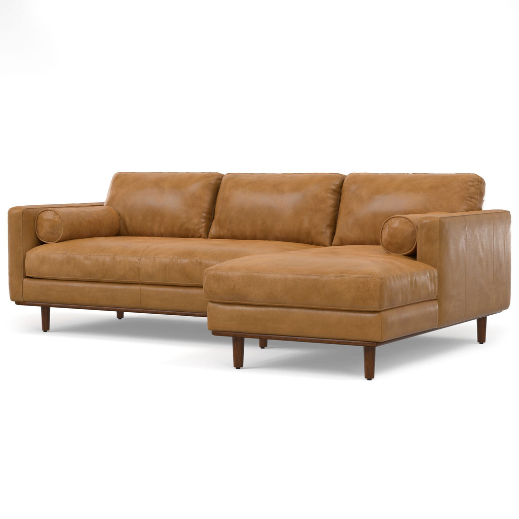 Light brown upholstered sectional sofa with chaise and rounded bolster armrests