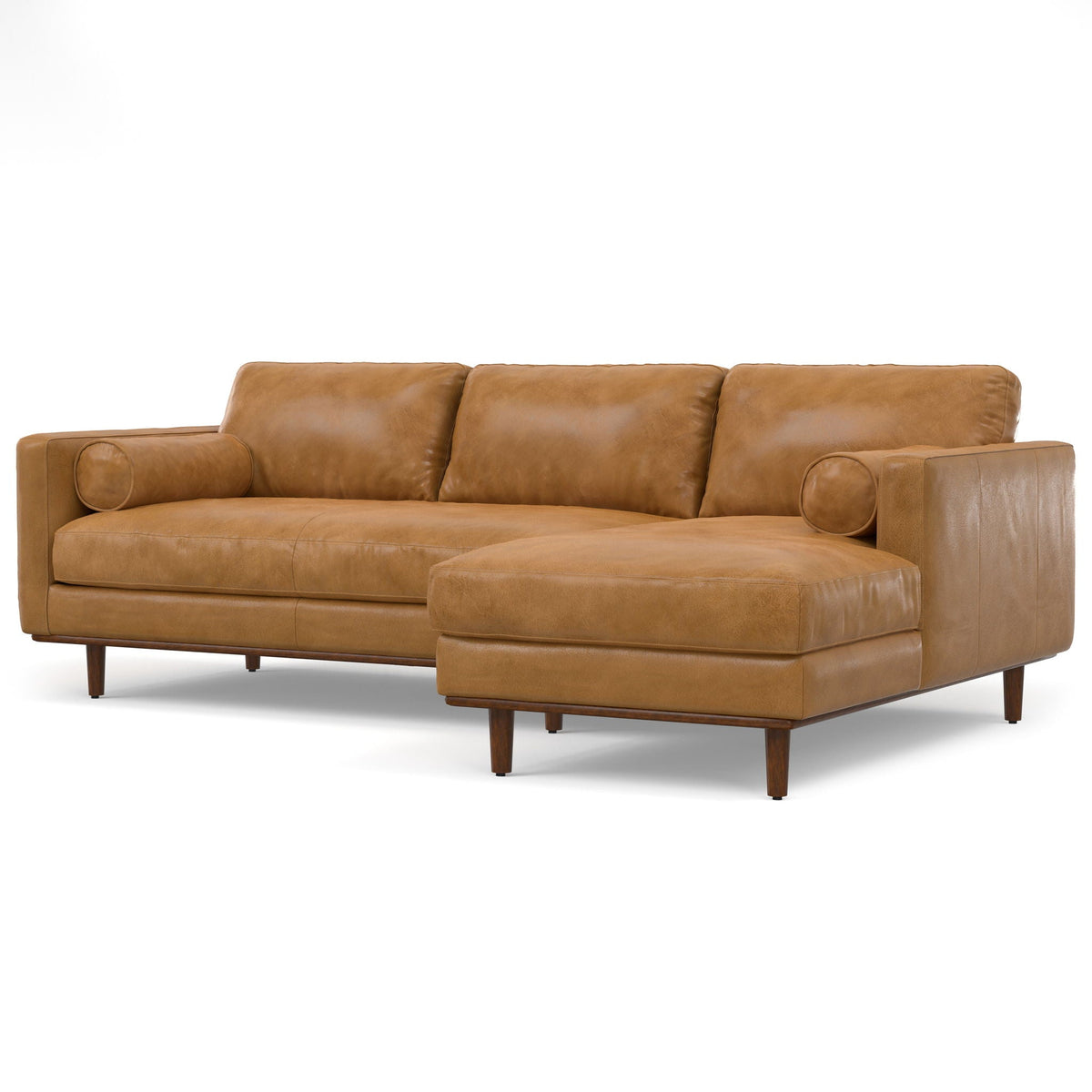Light brown upholstered sectional sofa with chaise and rounded bolster armrests