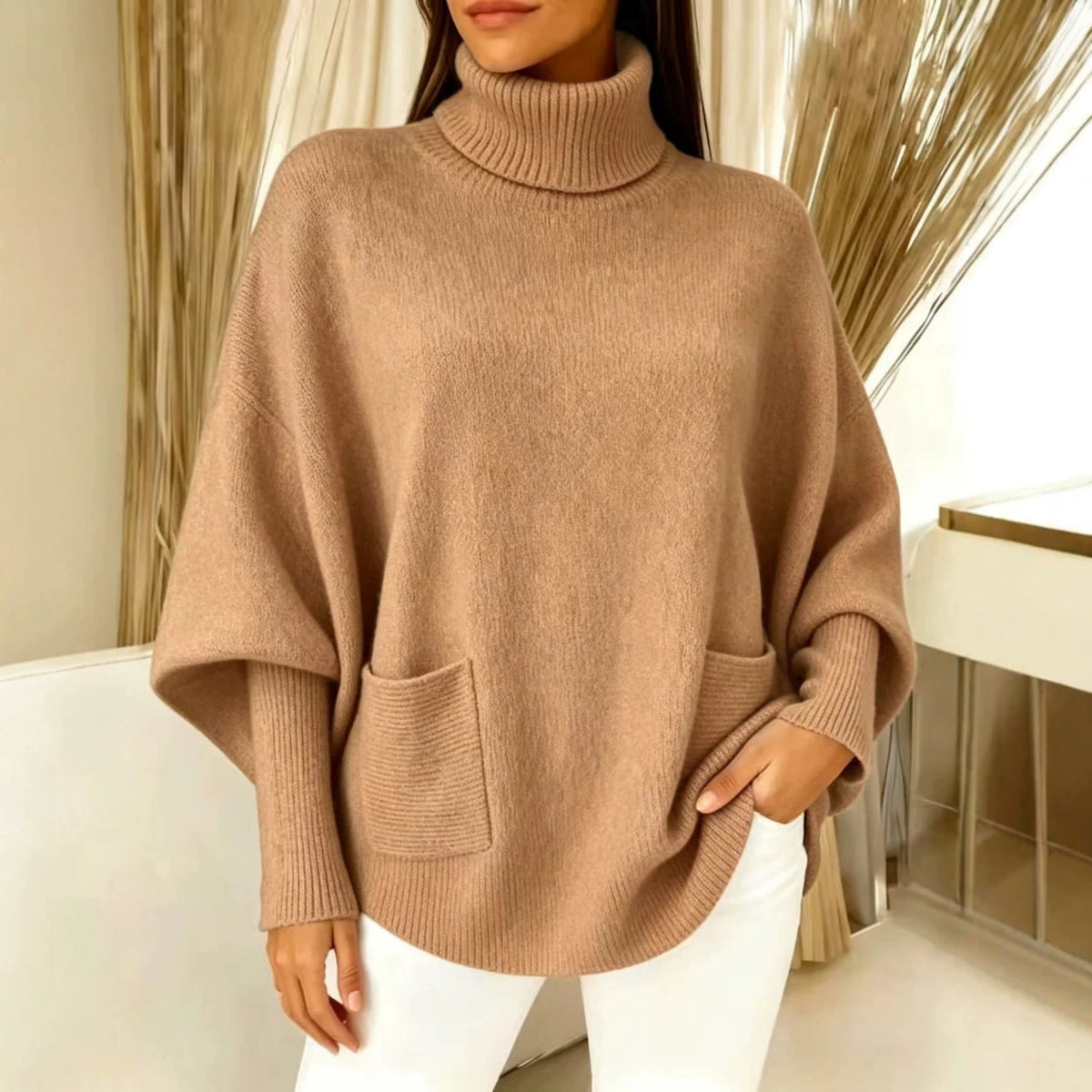 Camel brown women’s turtleneck sweater with long sleeves and front patch pocket