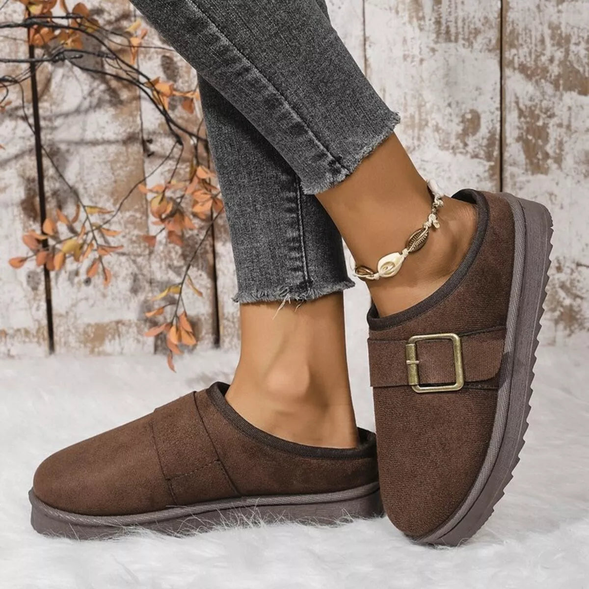Chocolate-brown plush-lined slippers with buckle strap and thick cushioned outsole