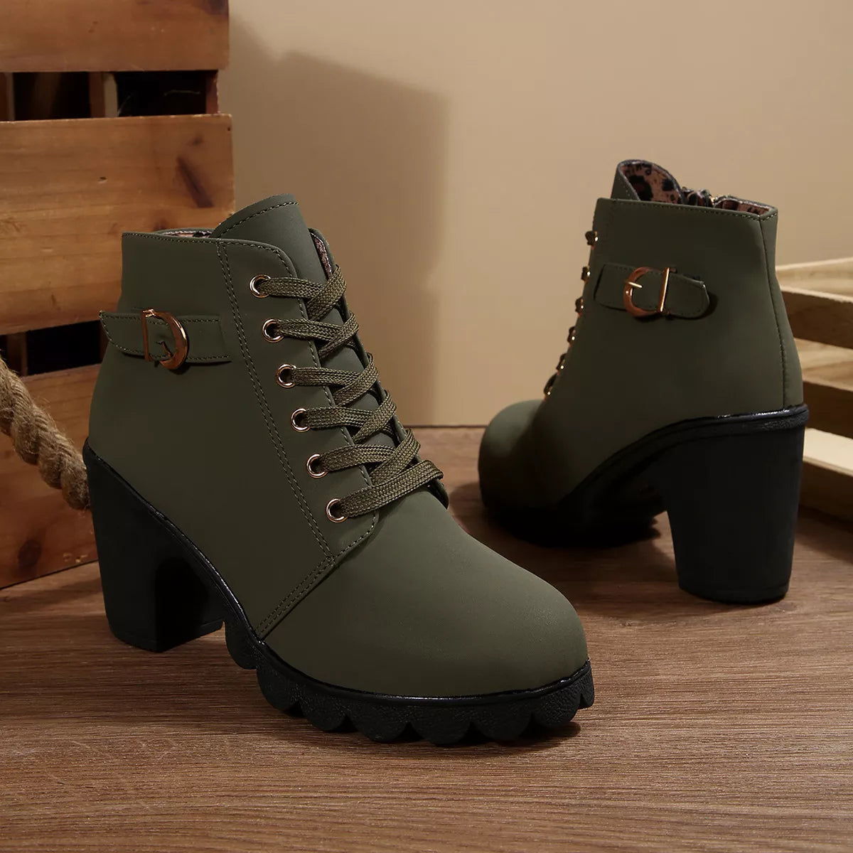 Olive green lace-up ankle boots with chunky heel and buckle strap, rugged lug sole