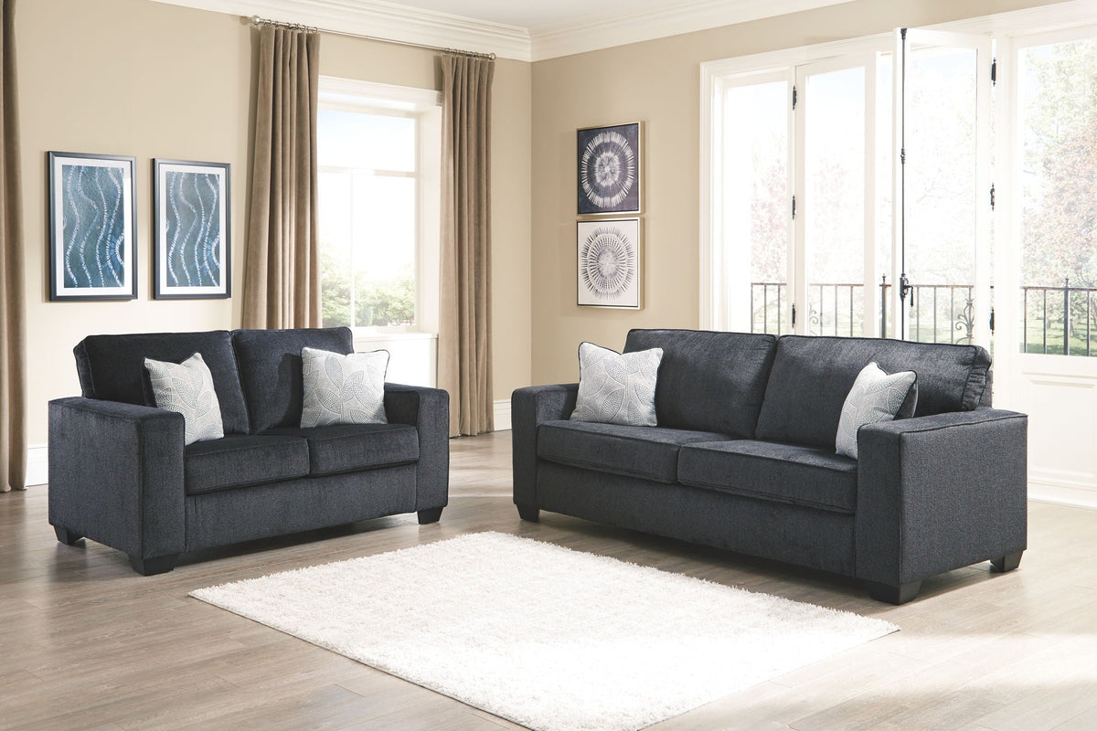 Dark gray fabric sofa and loveseat set with accent pillows