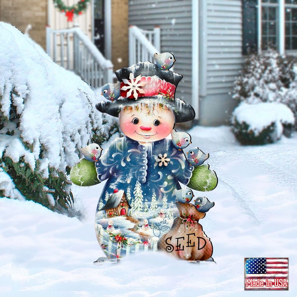 Christmas yard sign snowman with birds and 'SEED' basket, surrounded by snow
