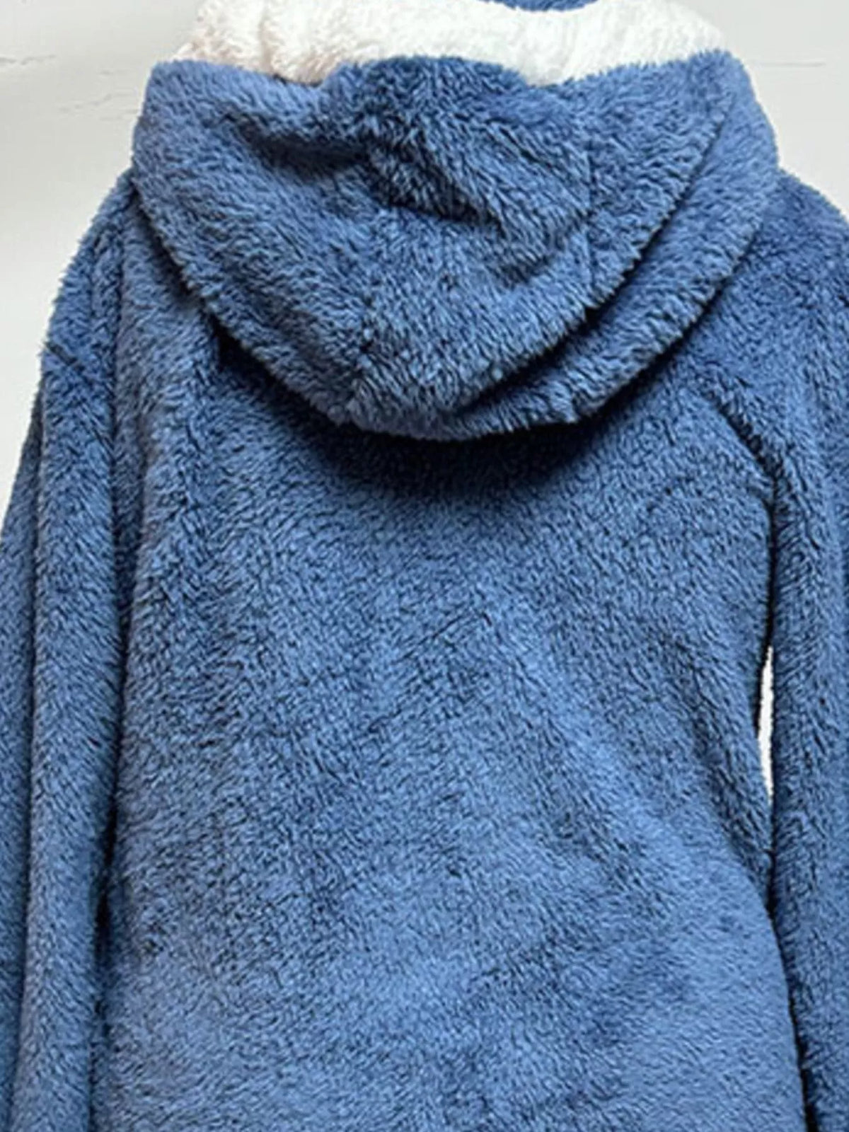 Blue fleece hooded jacket with sherpa-style hood lining