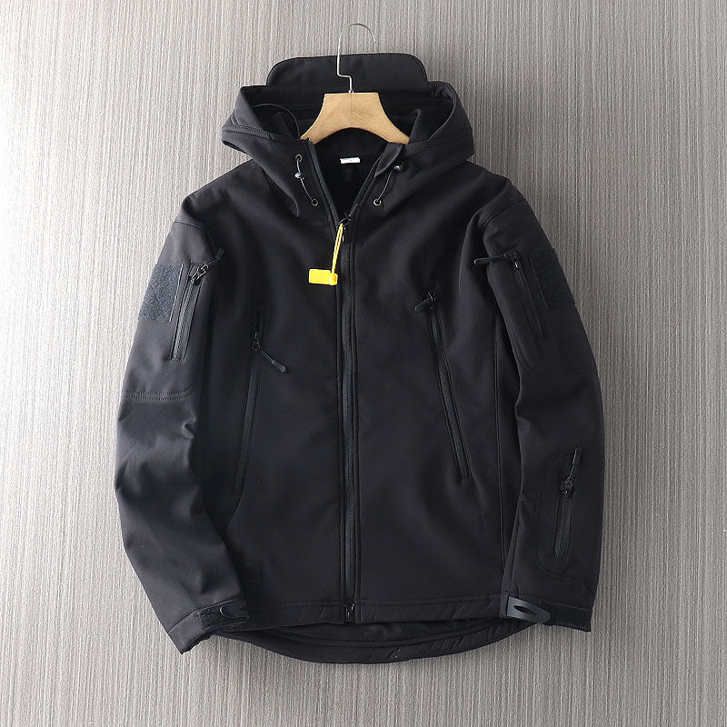 Men's waterproof shell jacket in black, front zip with hood and yellow tag