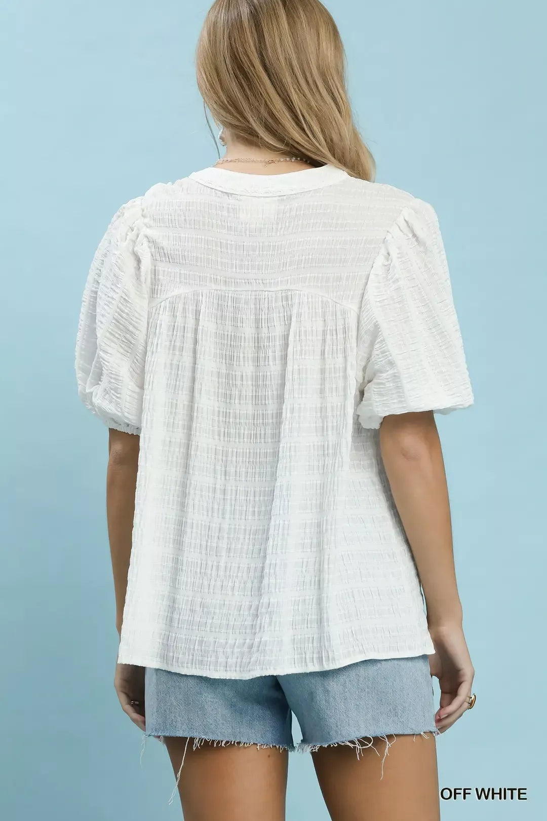 Off-white textured puff-sleeve blouse with back yoke pleats